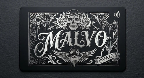a black rectangular card with an ornate, decorative design and text.