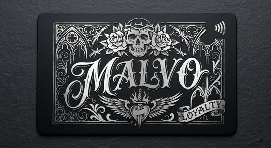a black rectangular card with an ornate, decorative design and text.